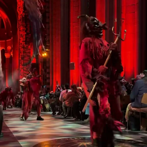 Performers in procession down the cathedral aisle